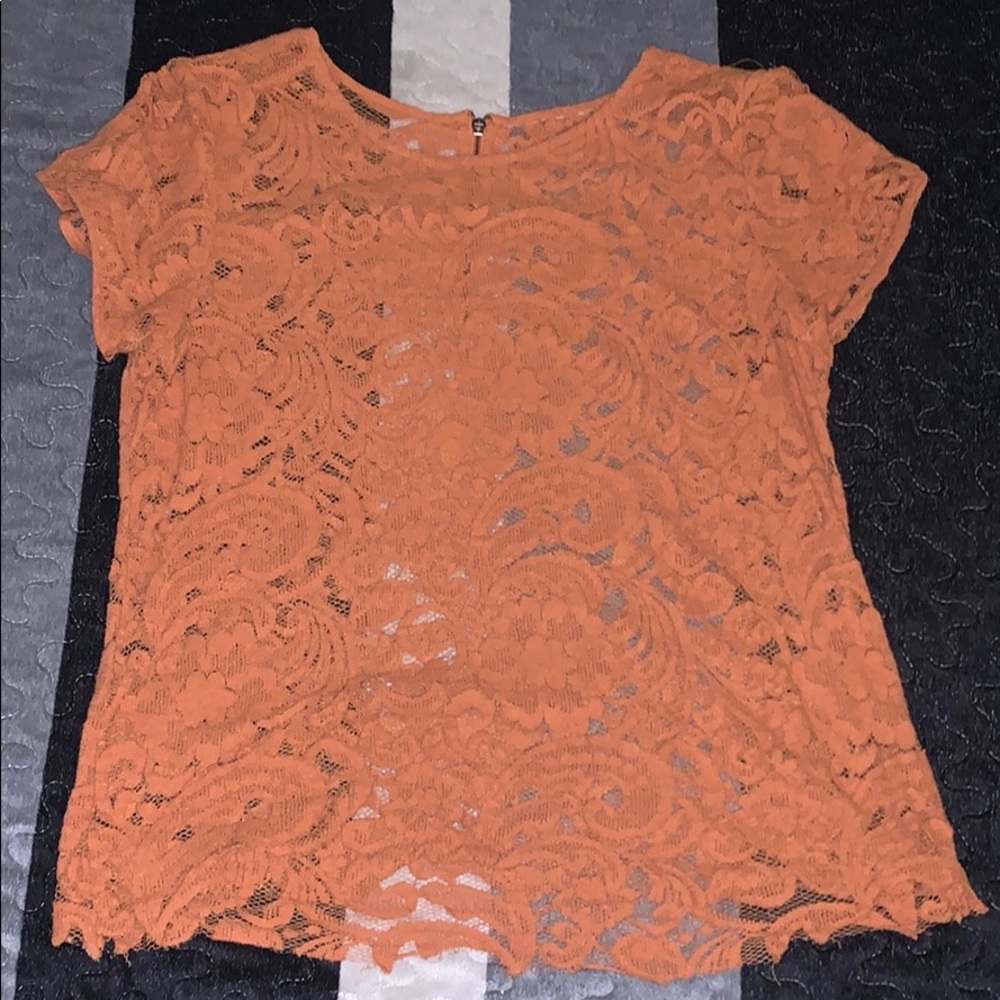 A see through brownish shirt